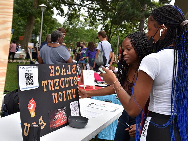 Students learn about the Black Student Union during the involvement fair