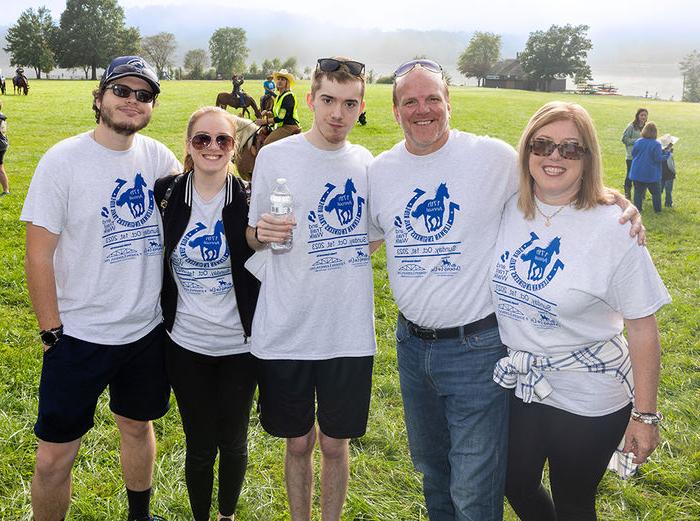 Carson and Sydney with their parents and Sydney’s fiancé, Matt, whom she met at Penn State Altoona. The group is at a therapeutic horseback riding event.