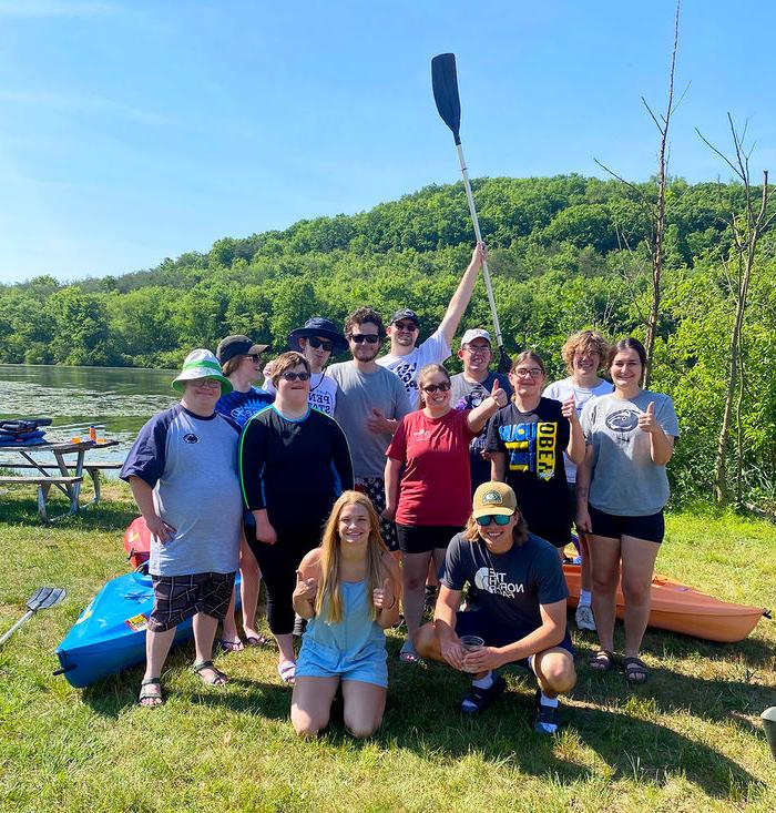 Emma Rebar (far left) and Taylor Greene (kneeling on right) organized a We Are Friends day of kayaking at Canoe Creek State Park over the summer.